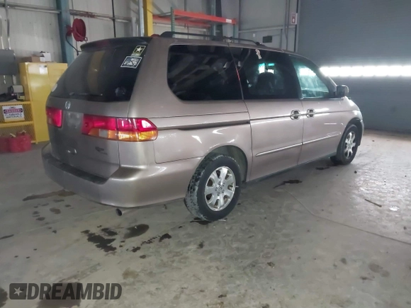 2003 Honda Odyssey EX-L with VIN 5FNRL18923B117592, listed as a IAAI auction lot 41546119 with 212,755 mi miles and . Bid and sale history available at DreamBid. Image 4.