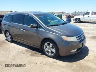 2012 Honda Odyssey Touring with VIN 5FNRL5H93CB109394, listed as a IAAI auction lot 42280018 with 190,412 mi miles and . Bid and sale history available at DreamBid. Image 1.
