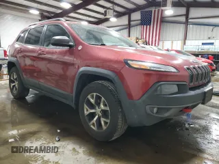 2015 Jeep Cherokee Trailhawk with VIN 1C4PJMBB8FW576765, listed as a Copart auction lot 49097925 with 299,877 mi miles and Clean Title. Bid and sale history available at DreamBid. Image 4.
