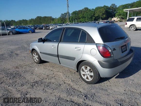 2009 Kia Rio LX with VIN KNADE243096440150, listed as a IAAI auction lot 42152589 with 114,484 mi miles. Bid and sale history available at carsss.com. Image 3.