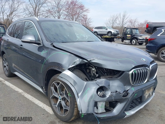 2019 BMW X1 xDrive28i with VIN WBXHT3C51K5L90571, listed as a IAAI auction lot 41909209 with 35,902 mi miles. Bid and sale history available at carsss.com. Image 6.