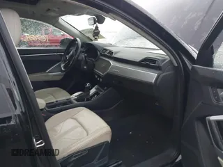 2019 Audi Q3 Premium with VIN WA1AECF34K1077471, listed as a IAAI auction lot 42658213 with 125,889 mi miles and . Bid and sale history available at DreamBid. Image 5.