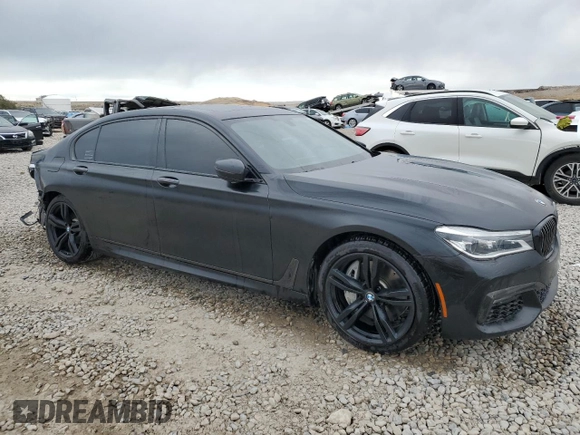 2018 BMW 7 Series 750i with VIN WBA7F0C55JGM23537, listed as a Copart auction lot 76824074 with 64,682 mi miles and Salvage Title. Bid and sale history available at carsss.com. Image 4.