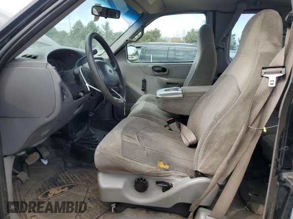 1999 Ford F-150 with VIN 1FTRX18W1XKC00918, listed as a Copart auction lot 53830305 with 205,205 mi miles and Salvage title. Bid and sale history available at DreamBid. Image 7.