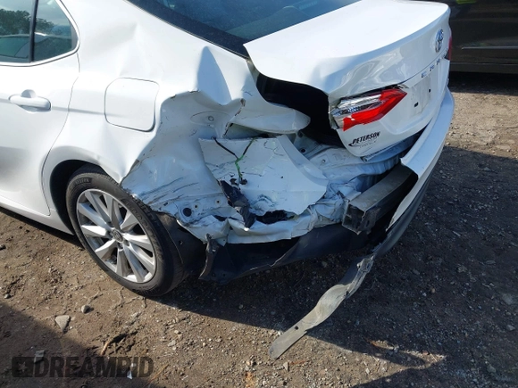 2020 Toyota Camry LE with VIN 4T1C11AKXLU986310, listed as a IAAI auction lot 40977100 with 108,208 mi miles and . Bid and sale history available at DreamBid. Image 6.