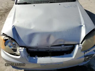 2005 Hyundai Accent GLS with VIN KMHCG45C75U638812, listed as a Copart auction lot 77968234 with 130,815 mi miles and Salvage Title. Bid and sale history available at carsss.com. Image 12.