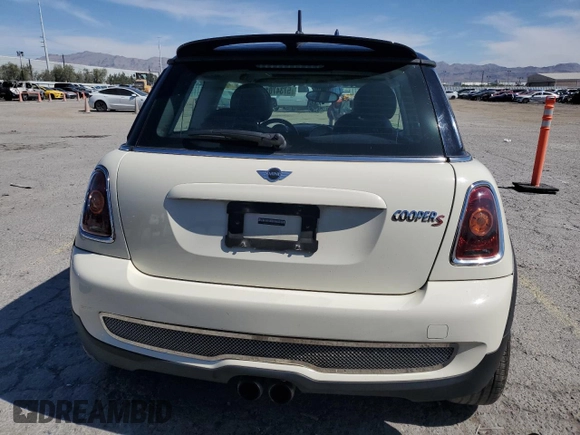 2009 MINI Hardtop S with VIN WMWMF73559TW83208, listed as a Copart auction lot 57347015 with 76,898 mi miles and Salvage title. Bid and sale history available at DreamBid. Image 6.