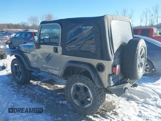 2004 Jeep Wrangler Sahara with VIN 1J4FA59S94P731123, listed as a IAAI auction lot 41288284 with 138,515 mi miles and . Bid and sale history available at DreamBid. Image 3.