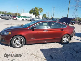 2016 Ford Fusion Titanium Hybrid with VIN 3FA6P0RU8GR127140, listed as a IAAI auction lot 41750405 with 110,861 mi miles. Bid and sale history available at carsss.com. Image 15.