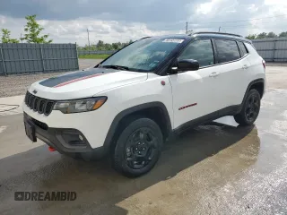 2023 Jeep Compass Trailhawk with VIN 3C4NJDDN5PT567737, listed as a Copart auction lot 61824665 with 43,843 mi miles and Clean title. Bid and sale history available at DreamBid. Image 1.