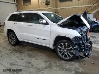 2017 Jeep Grand Cherokee Overland with VIN 1C4RJECG9HC965752, listed as a Copart auction lot 83874784 with 106,604 mi miles and Salvage Title. Bid and sale history available at carsss.com. Image 4.