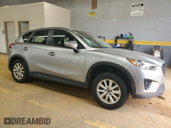 2013 Mazda CX-5 Sport with VIN JM3KE2BE6D0110272, listed as a Copart auction lot 57570725 with 124,475 mi miles and Salvage title. Bid and sale history available at DreamBid. Image 4.