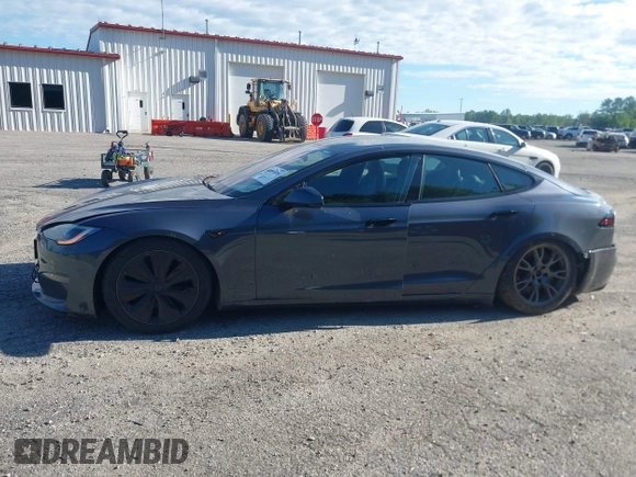 2022 Tesla Model S with VIN 5YJSA1E57NF479056, listed as a IAAI auction lot 42091009 with 78,272 mi miles and . Bid and sale history available at DreamBid. Image 14.