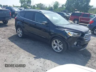 2019 Ford Escape Titanium with VIN 1FMCU9J99KUA13453, listed as a IAAI auction lot 42723778 with 27,560 mi miles and . Bid and sale history available at DreamBid. Image 1.