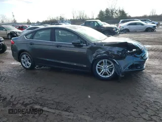 2018 Ford Fusion SE z VIN 3FA6P0HD7JR259606, wystawiony jako IAAI lot #41649797 z przebiegiem 94 094 mil mil oraz . Historia ofert i sprzedaży dostępna na DreamBid. Obrazek 13.