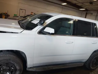 2018 Chevrolet Tahoe Commercial with VIN 1GNSKDEC7JR240082, listed as a IAAI auction lot 41608557 with 111,834 mi miles. Bid and sale history available at carsss.com. Image 14.
