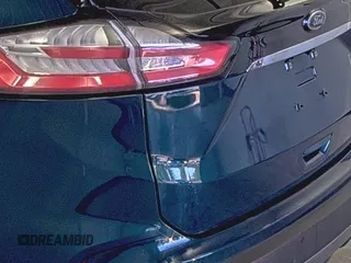 2020 Ford Edge Titanium z VIN 2FMPK3K91LBB37761, wystawiony jako IAAI lot #42829390 z przebiegiem 90 117 mil mil oraz . Historia ofert i sprzedaży dostępna na DreamBid. Obrazek 5.