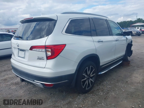 2020 Honda Pilot Elite with VIN 5FNYF6H08LB014288, listed as a IAAI auction lot 40496871 with 57,921 mi miles and . Bid and sale history available at DreamBid. Image 4.