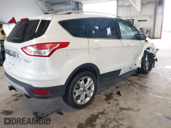 2016 Ford Escape Titanium with VIN 1FMCU9J90GUA18743, listed as a IAAI auction lot 42419730 with 102,666 mi miles and . Bid and sale history available at DreamBid. Image 4.