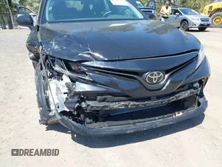 2020 Toyota Camry LE with VIN 4T1C11AK9LU387012, listed as a IAAI auction lot 42103647 with 64,049 mi miles and . Bid and sale history available at carsss.com. Image 6.