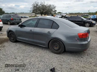 2014 Volkswagen Jetta S with VIN 3VW2K7AJ8EM231099, listed as a Copart auction lot 65752605 with 143,010 mi miles and Salvage title. Bid and sale history available at DreamBid. Image 2.