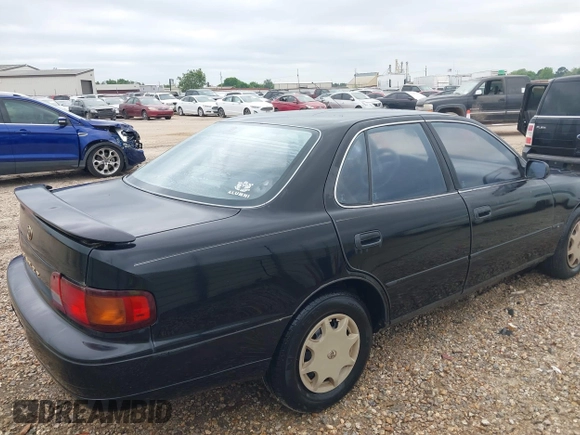 1996 Toyota Camry DX with VIN 4T1BG12K6TU754392, listed as a IAAI auction lot 42013697 with 172,410 mi miles. Bid and sale history available at carsss.com. Image 4.