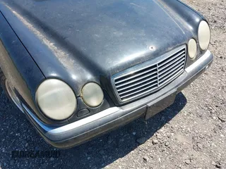 1997 Mercedes-Benz E-Class with VIN WDBJF72F8VA309745, listed as a IAAI auction lot 42119469 with 131,318 mi miles. Bid and sale history available at carsss.com. Image 6.