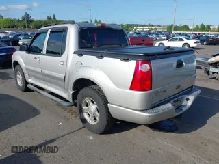2004 Ford Explorer Sport Trac XLS z VIN 1FMDU77K74UB69268, wystawiony jako IAAI lot #42055157 z przebiegiem 127 573 mil mil oraz . Historia ofert i sprzedaży dostępna na DreamBid. Obrazek 3.