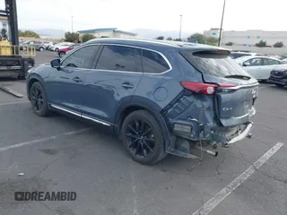 2021 Mazda CX-9 Grand Touring with VIN JM3TCADY1M0519288, listed as a IAAI auction lot 41186094 with 50,701 mi miles and . Bid and sale history available at DreamBid. Image 3.