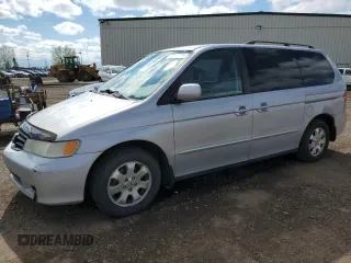 2002 Honda Odyssey EX z VIN 2HKRL186X2H006763, wystawiony jako Copart lot #57317075 z przebiegiem 282 090 mil mil oraz Szkoda całkowita • Salvage title. Historia ofert i sprzedaży dostępna na DreamBid. Obrazek 1.