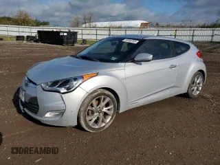 2017 Hyundai Veloster Value Edition z VIN KMHTC6AD8HU318621, wystawiony jako Copart lot #55346755 z przebiegiem 143 901 mil mil oraz Tytuł czysty. Historia ofert i sprzedaży dostępna na DreamBid. Obrazek 1.
