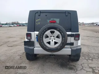 2008 Jeep Wrangler Unlimited Sahara с VIN 1J4GA59138L505460, выставлен на аукционе IAAI как лот 41846611 с пробегом 116 658 миль миль и . История ставок и продаж доступна на DreamBid. Изображение 16.