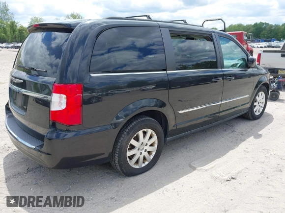 2014 Chrysler Town & Country Touring with VIN 2C4RC1BG2ER206979, listed as a IAAI auction lot 42200266 with 217,610 mi miles and . Bid and sale history available at DreamBid. Image 4.
