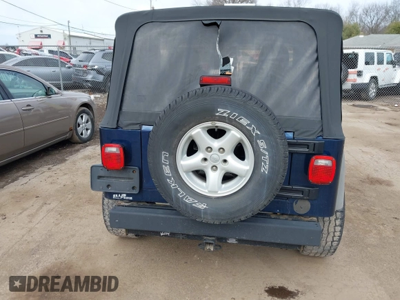2005 Jeep Wrangler Sport with VIN 1J4FA49S05P384308, listed as a IAAI auction lot 41821354 with 106,394 mi miles. Bid and sale history available at carsss.com. Image 16.