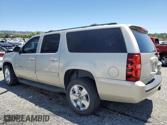 2013 Chevrolet Suburban LT with VIN 1GNSCJE06DR140058, listed as a Copart auction lot 56317995 with 124,345 mi miles and Salvage title. Bid and sale history available at DreamBid. Image 2.