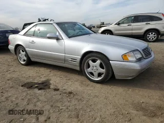 1999 Mercedes-Benz SL-Class with VIN WDBFA68F4XF184335, listed as a Copart auction lot 86287834 with 97,564 mi miles and Salvage Title. Bid and sale history available at carsss.com. Image 4.