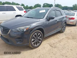 2016 Mazda CX-5 Grand Touring z VIN JM3KE2DY5G0801238, wystawiony jako IAAI lot #42264694 z przebiegiem 136 993 mil mil oraz . Historia ofert i sprzedaży dostępna na DreamBid. Obrazek 2.