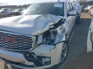 2020 GMC Yukon XL Denali with VIN 1GKS1HKJ6LR282854, listed as a IAAI auction lot 41717072 with 56,715 mi miles and . Bid and sale history available at DreamBid. Image 6.