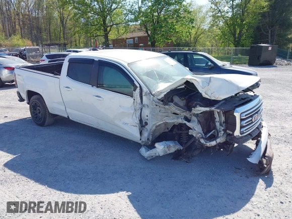 2019 GMC Canyon 4WD SLE z VIN 1GTG6CEN0K1353094, wystawiony jako IAAI lot #42065160 z przebiegiem 73 235 mil mil oraz . Historia ofert i sprzedaży dostępna na DreamBid. Obrazek 1.