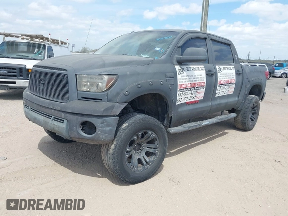 2013 Toyota Tundra 4WD Truck with VIN 5TFDW5F14DX279527, listed as a IAAI auction lot 41594899 with 212,973 mi miles. Bid and sale history available at carsss.com. Image 2.