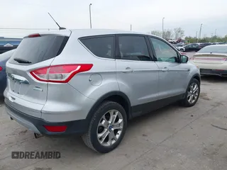 2013 Ford Escape SEL with VIN 1FMCU0HX1DUB81641, listed as a IAAI auction lot 42090788 with 111,496 mi miles and . Bid and sale history available at DreamBid. Image 4.