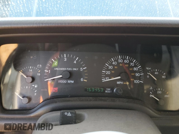 1998 Jeep Cherokee Sport with VIN 1J4FT68S4WL121559, listed as a Copart auction lot 77387794 with 163,453 mi miles and Salvage Title. Bid and sale history available at carsss.com. Image 9.