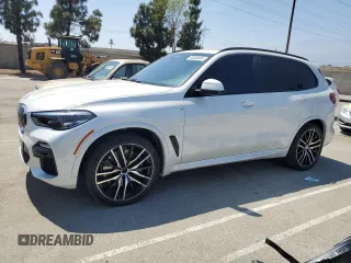 2019 BMW X5 xDrive40i with VIN 5UXCR6C57KLK85504, listed as a Copart auction lot 60908665 with 21,333 mi miles and Salvage title. Bid and sale history available at DreamBid. Image 1.