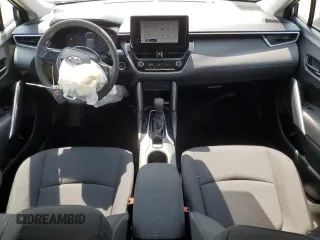 2023 Toyota Corolla Cross LE with VIN 7MUCAABG4PV054828, listed as a Copart auction lot 59466855 with 23,884 mi miles and Salvage title. Bid and sale history available at DreamBid. Image 8.