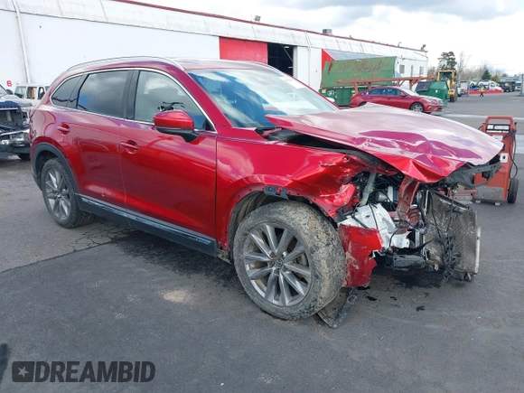 2020 Mazda CX-9 Grand Touring with VIN JM3TCBDY4L0423563, listed as a IAAI auction lot 41829394 with 76,704 mi miles and . Bid and sale history available at DreamBid. Image 1.