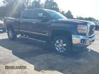 2015 GMC Sierra 2500HD SLT z VIN 1GT12ZE81FF606771, wystawiony jako IAAI lot #41716653 z przebiegiem 125 627 mil mil oraz . Historia ofert i sprzedaży dostępna na DreamBid. Obrazek 1.