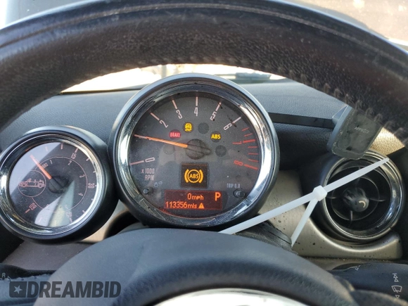 2015 MINI Convertible with VIN WMWZN3C53FT862859, listed as a Copart auction lot 71419764 with 113,356 mi miles and Salvage title. Bid and sale history available at DreamBid. Image 9.