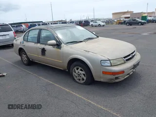 1997 Nissan Maxima GXE z VIN JN1CA21D2VM503099, wystawiony jako IAAI lot #41829162 z przebiegiem 115 123 mil mil oraz . Historia ofert i sprzedaży dostępna na DreamBid. Obrazek 1.