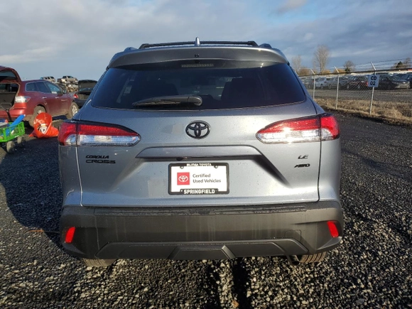 2022 Toyota Corolla Cross LE with VIN 7MUBAABG8NV027298, listed as a Copart auction lot 85073794 with 6,388 mi miles and Salvage Title. Bid and sale history available at carsss.com. Image 6.