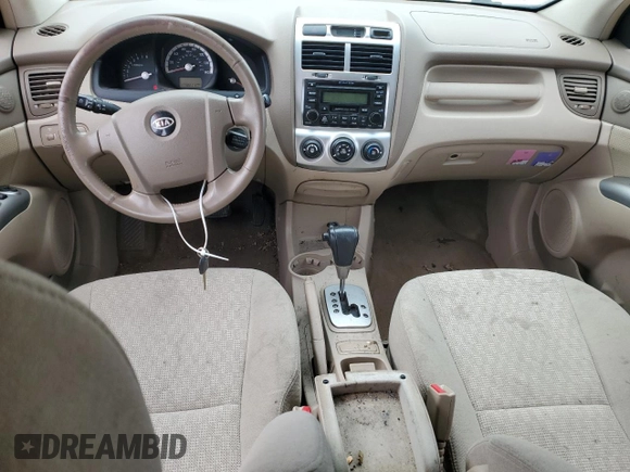 2005 Kia Sportage LX with VIN KNDJF723057125954, listed as a Copart auction lot 79454554 with 179,811 mi miles and Salvage Title. Bid and sale history available at carsss.com. Image 8.